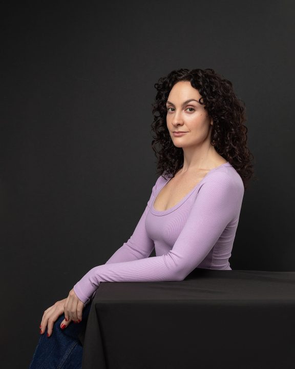 Personal branding portrait for Sally Rose - black background - diagonal composition