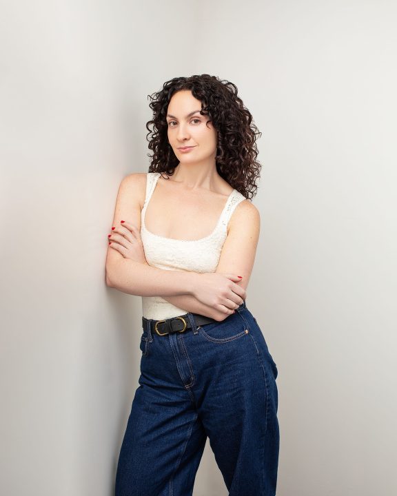 3/4 body headshot personal branding photo for Sally Rose - light background