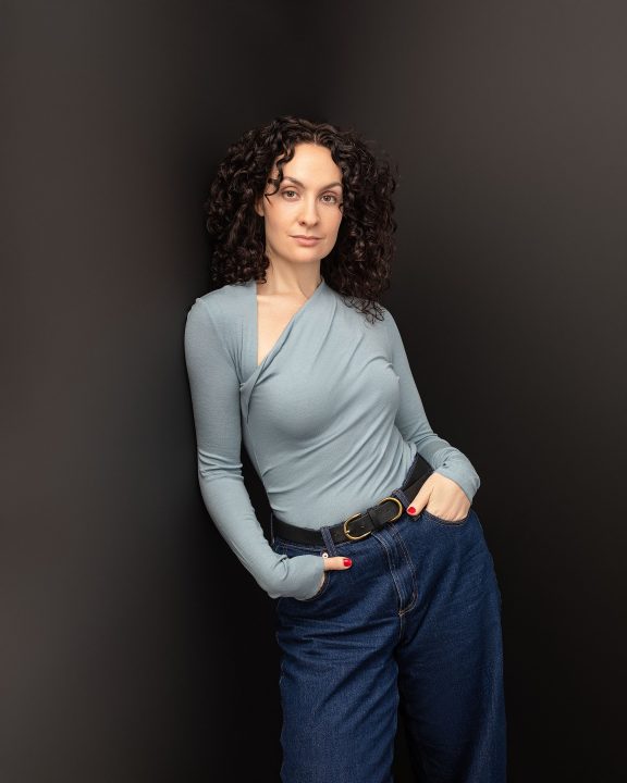 Personal branding portrait for Sally Rose - 3/4 body composition with black background