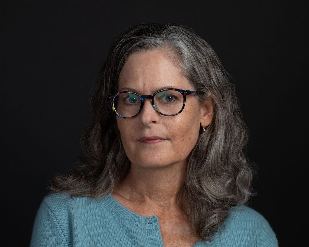Headshot of Maundy Mitchell with black background